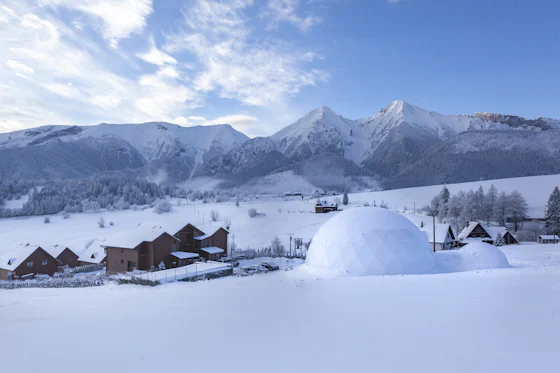 An igloo in a snowy mountain village