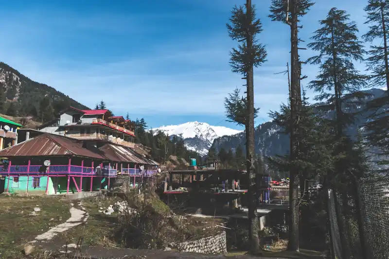 A mountain village beside a flowing river.